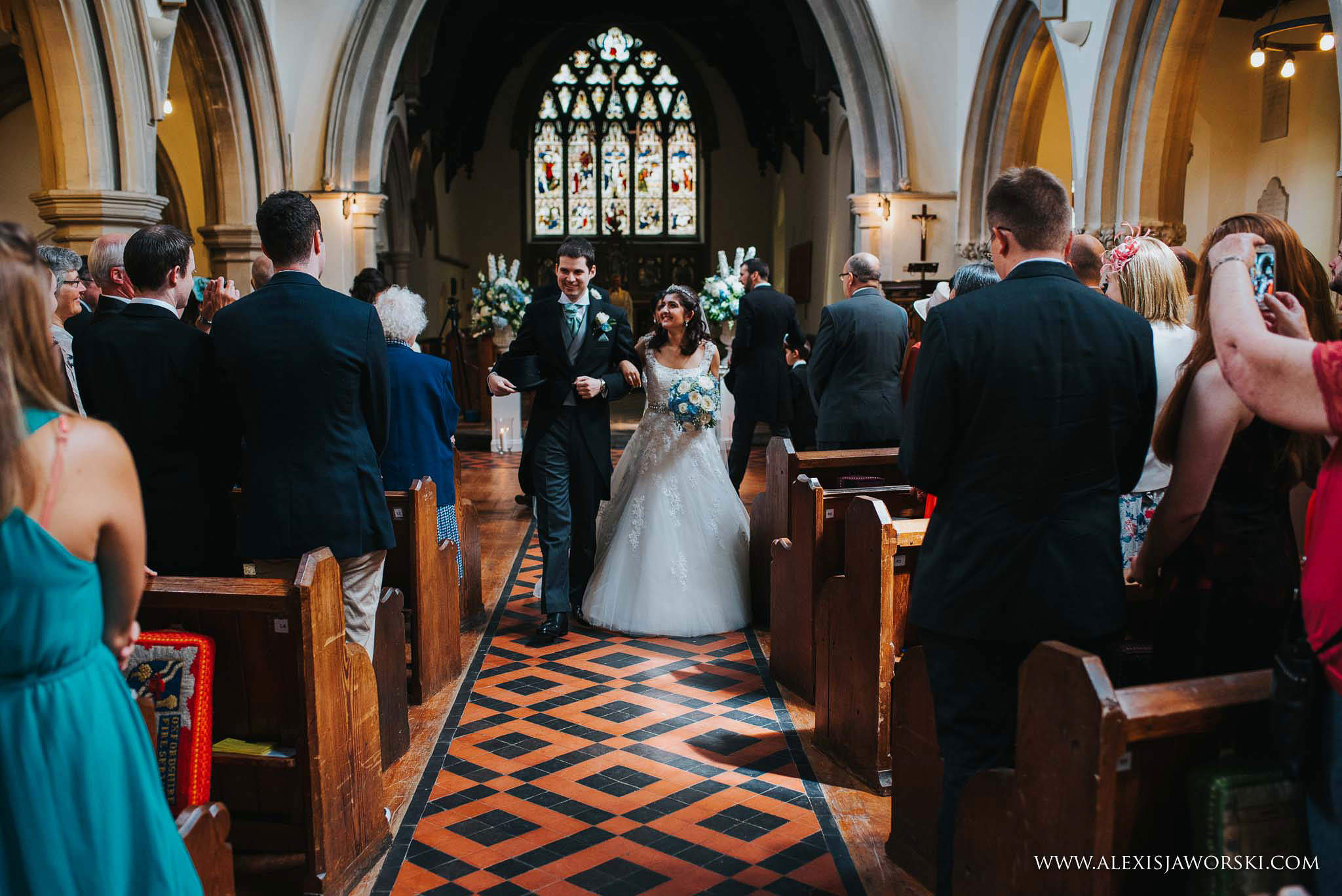 bride and groom leaving the church