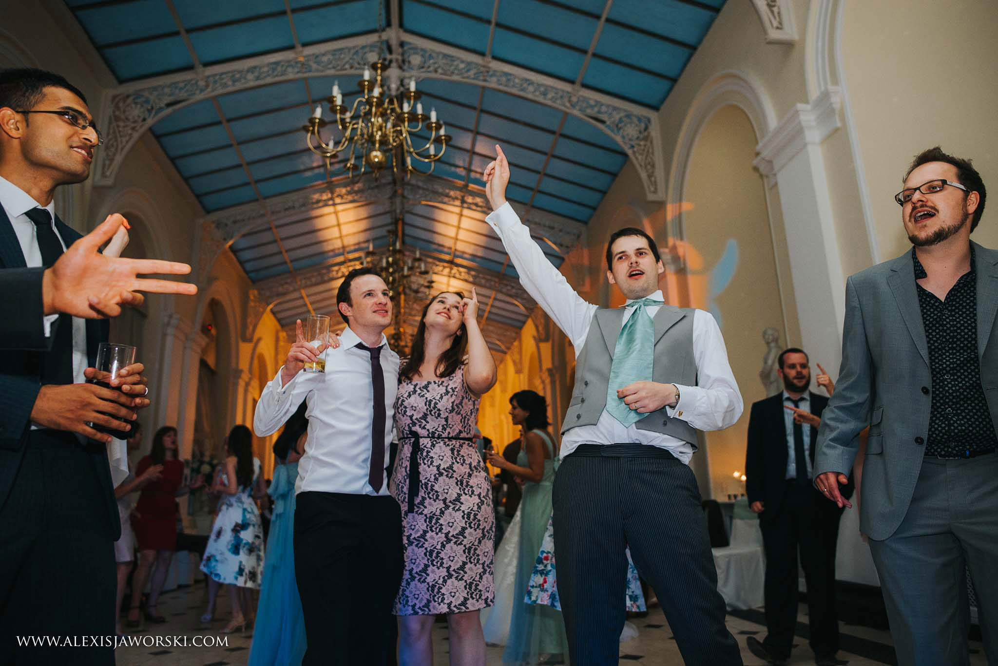 groom and friends adancing