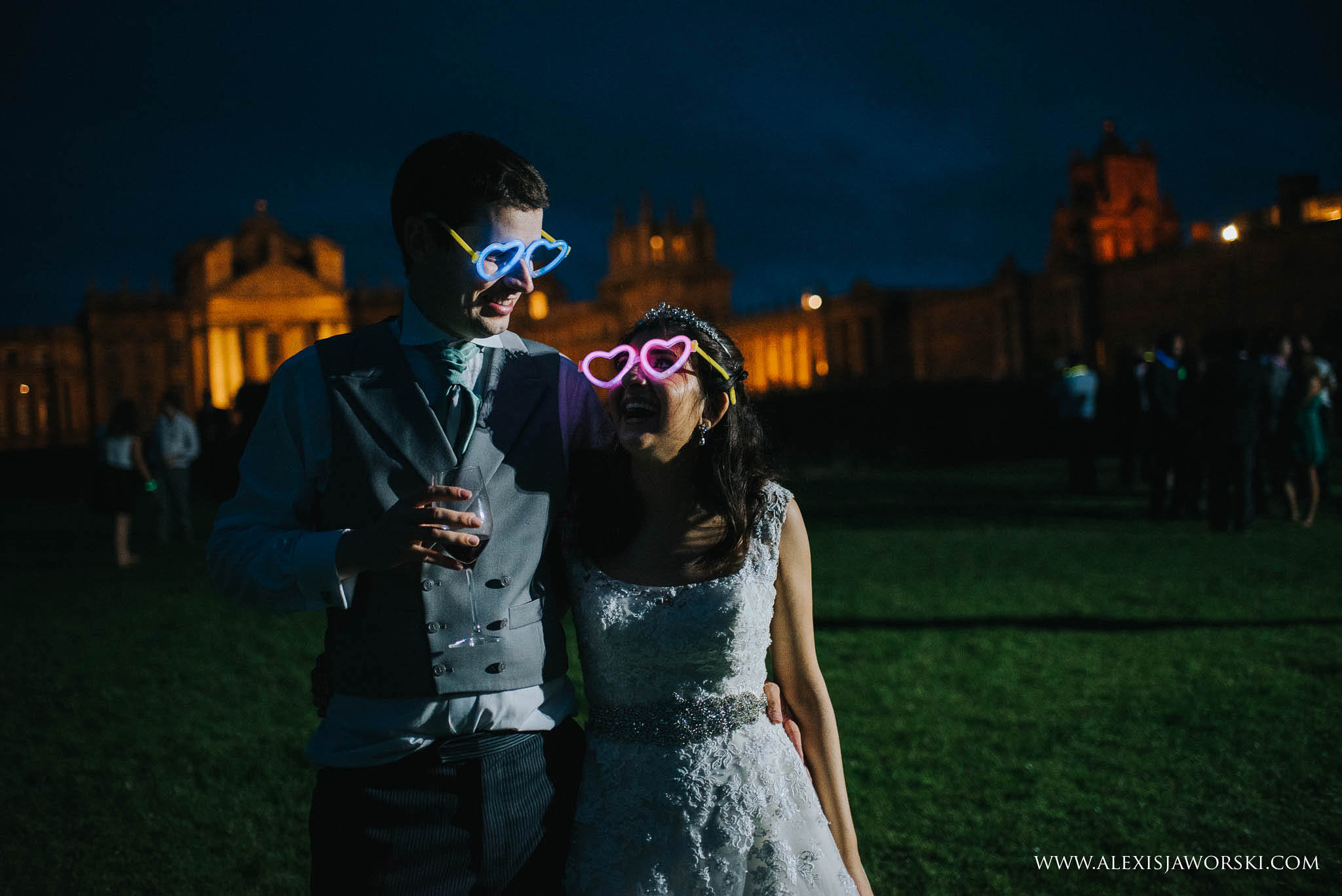 bride and groom wearing fluorescent glasses