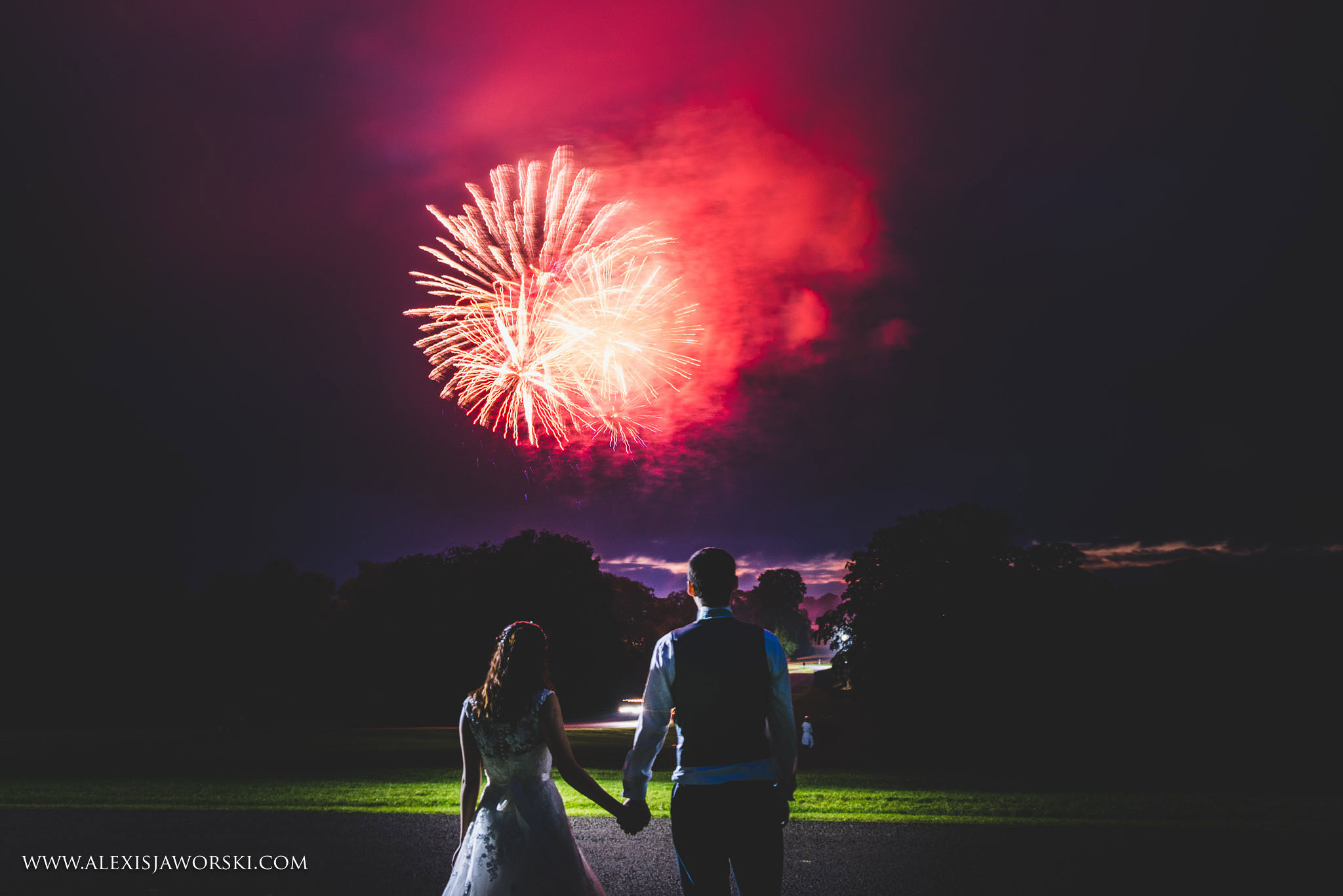 bride and groom watching fireworks