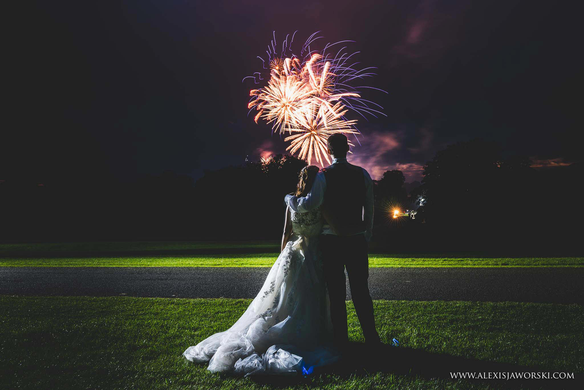 bride and groom watching fireworks