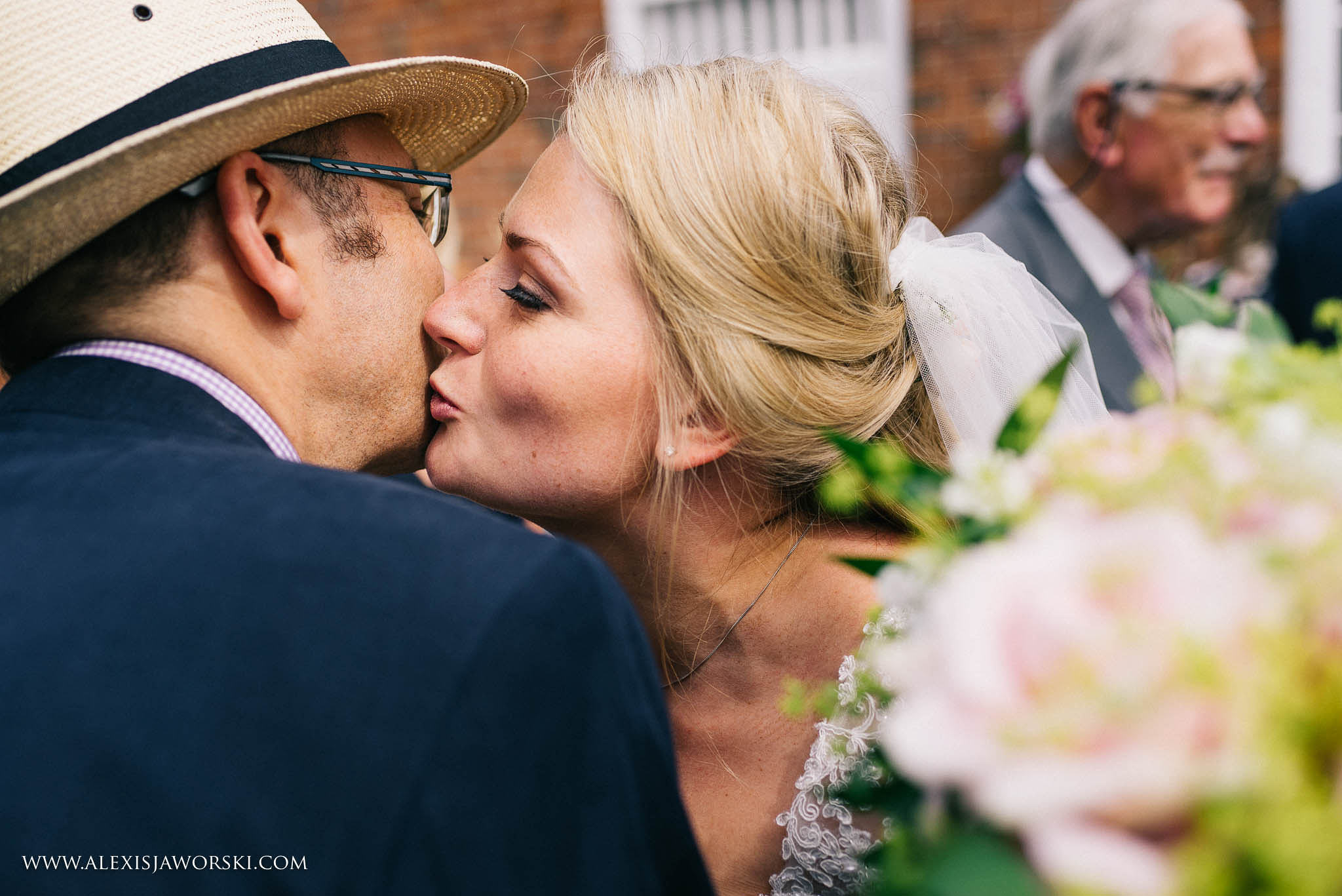 bride kissing a guest on the cheek