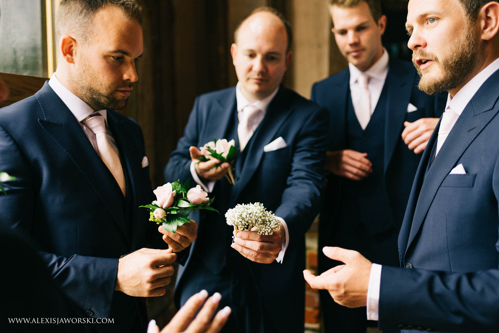 grooms wearing lapel flowers