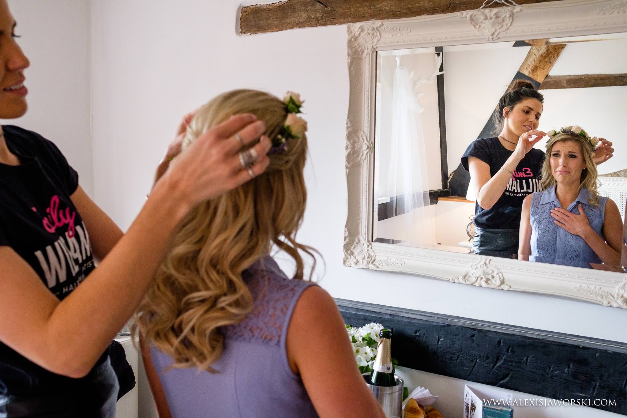 bride looking into mirror