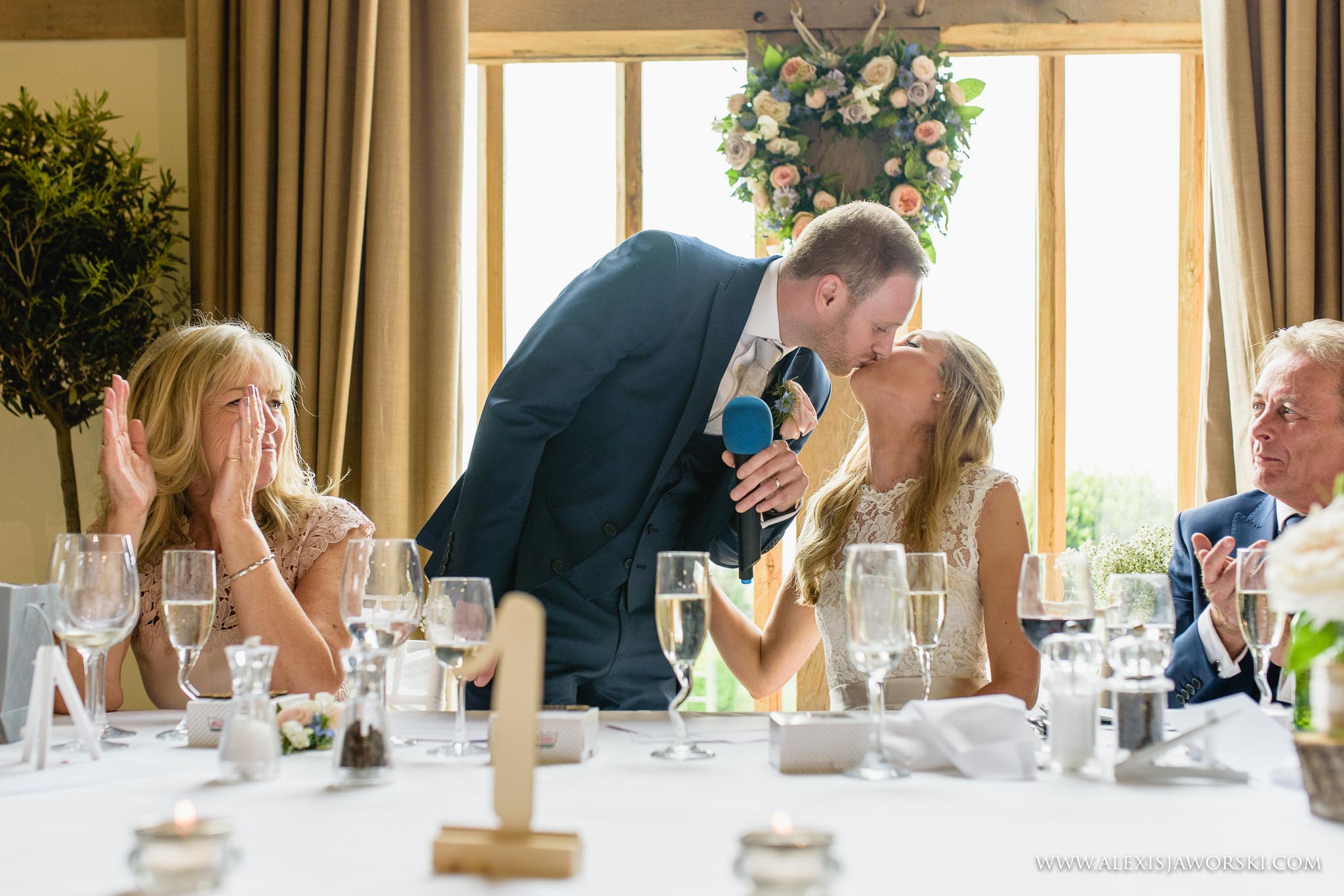 kiss by bride and groom