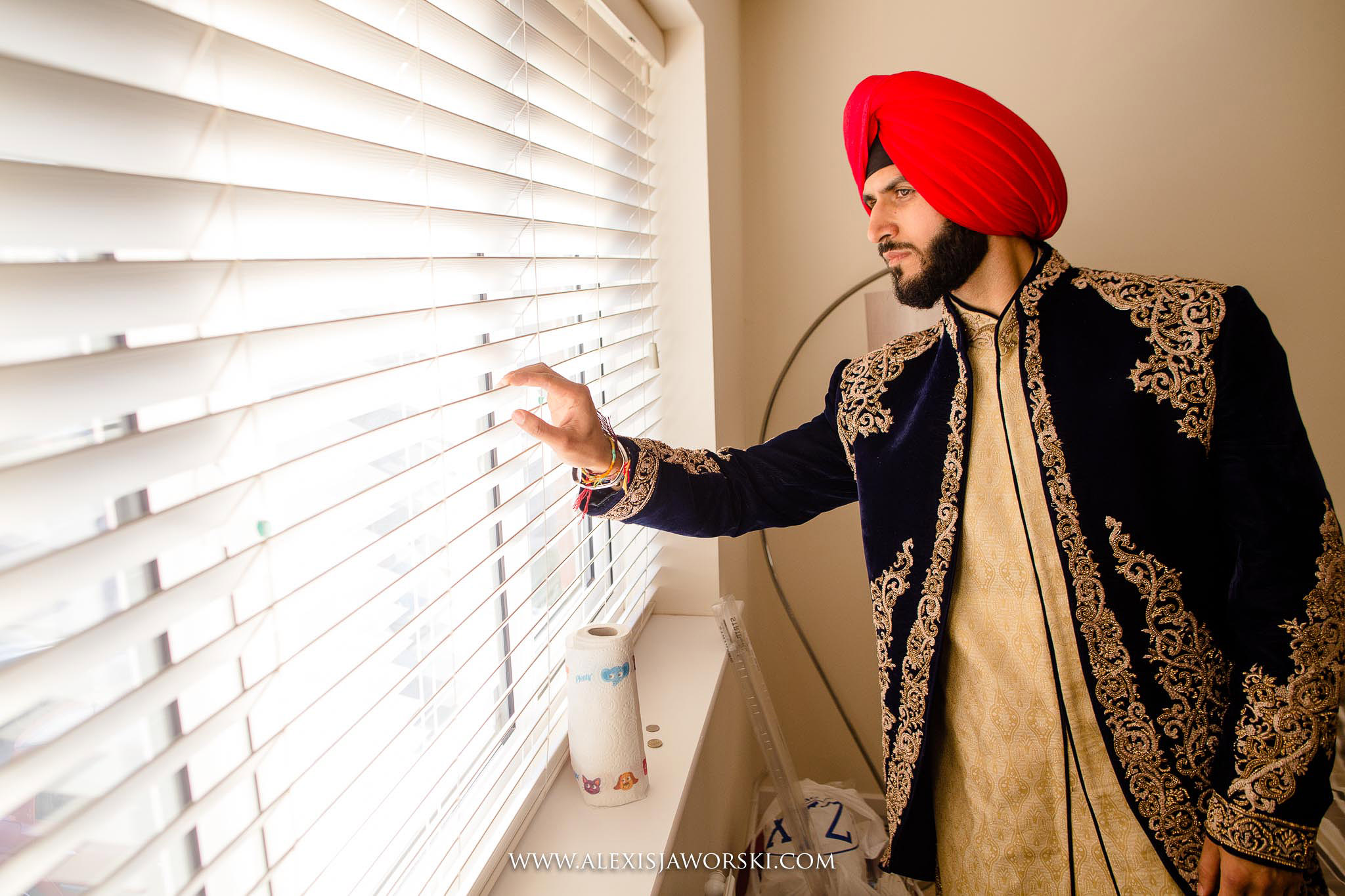 Groom looking out window