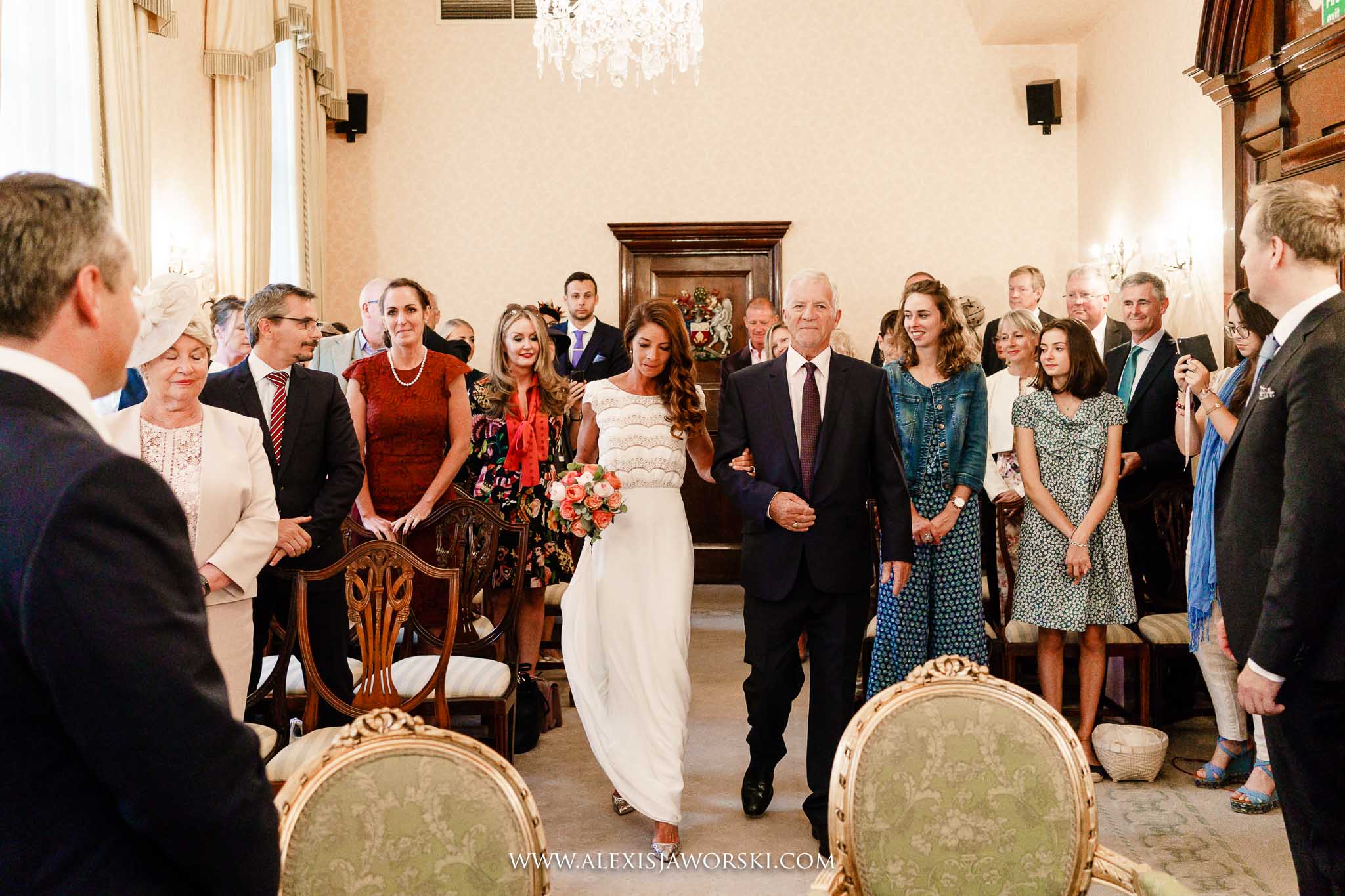 bride walking down the aisle with dad
