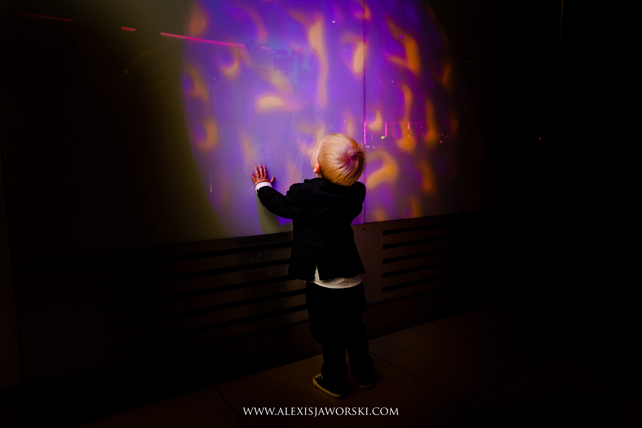 kid playing with lights