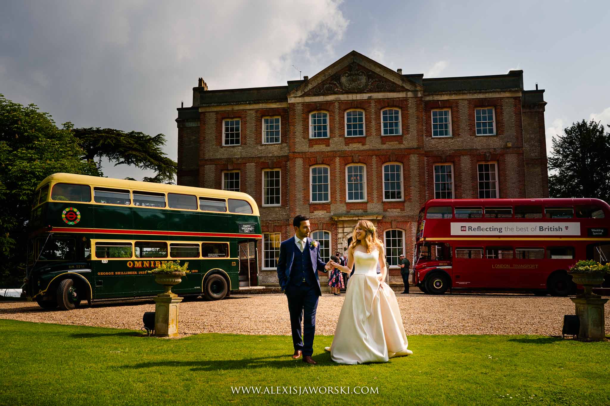bride and groom in front of the house