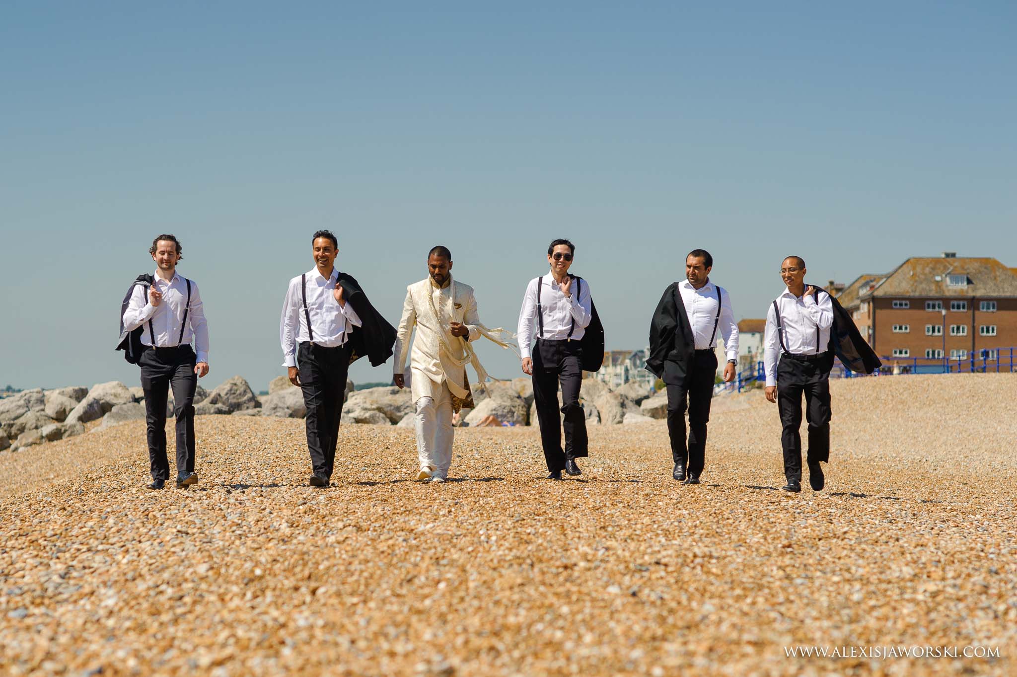 groom by the beach with the boys